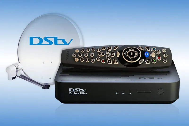 DStv Explora Ultra decoder with remote and a DStv satellite dish